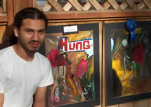 student standing in front of art