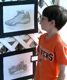 student admiring art