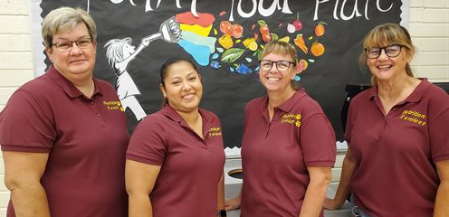 Staff smiling